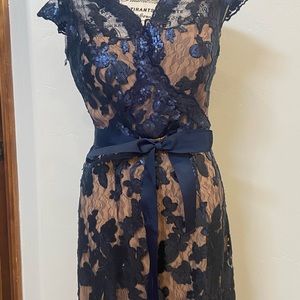 JS collections floor length dress. Navy blue illusion lace over a nude sheath.